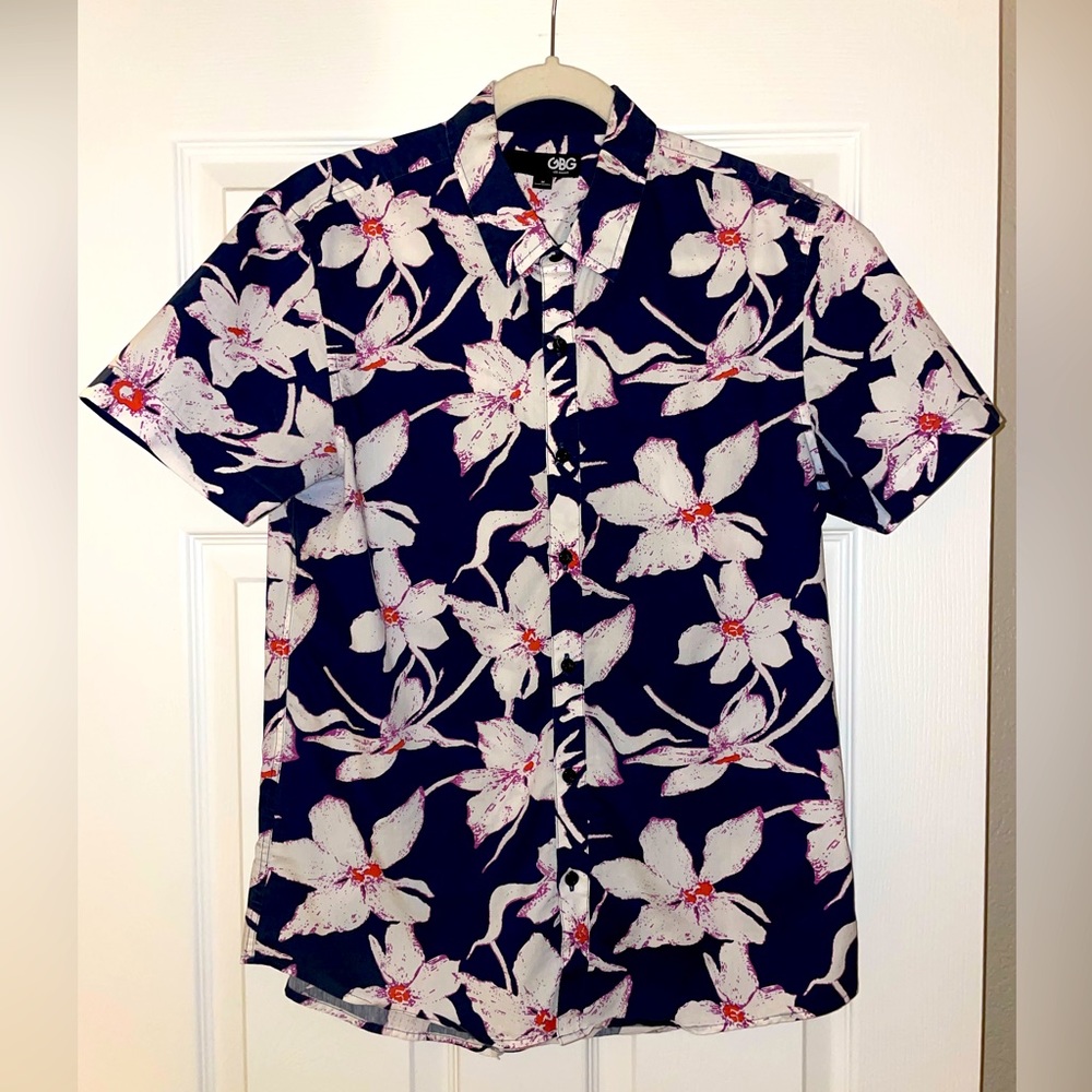 This is a GBG Los Angeles. 68% cotton 32% poly Size M (slim fitting)
